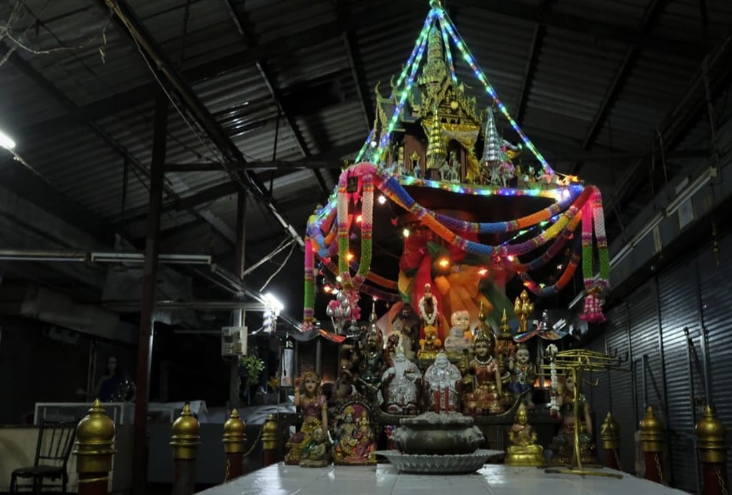 A miniature Buddhist temple on the second floor of a deserted market, which is part of the Bangkok Haunt ghost tour. Photo: James Wendlinger