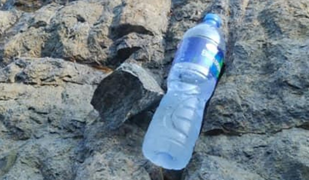 The rock that caused the damage. Hikers rarely get close enough to the edge to dislodge a rock, so climbers think it was thrown.