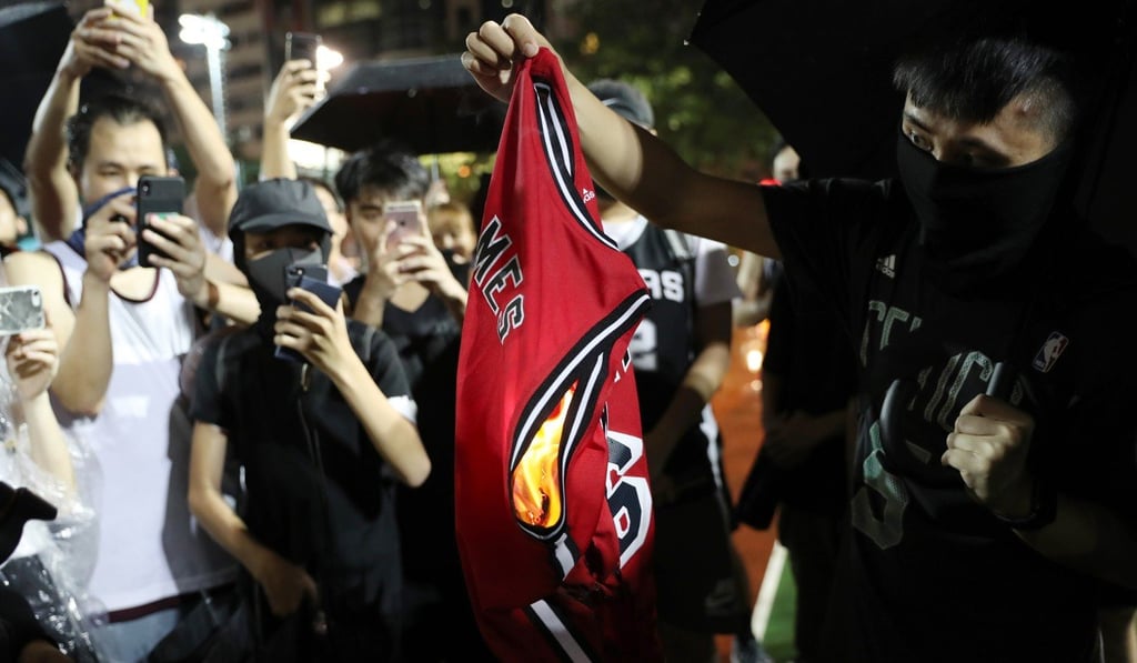 Basketball fans burn a LeBron James jersey at Southern Playground in Wan Chai. Photo: Sam Tsang