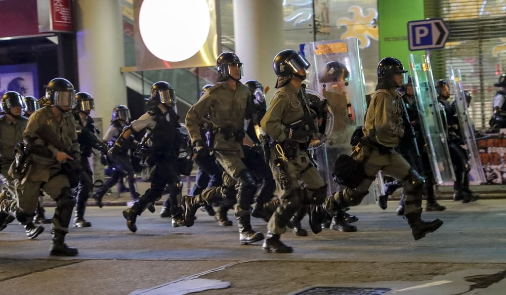 Anti-riot officers in Sham Shui Po during one of the many protests that have flared up citywide. Photo: Edmond So