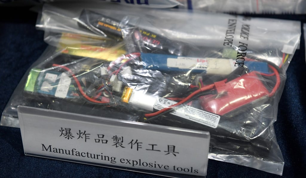 Tung Sheung and Ting Chin were initially accused of possessing explosive powders and two modified phone devices attached with a circuit board – as part of an improvised explosive device. Photo: Xinhua