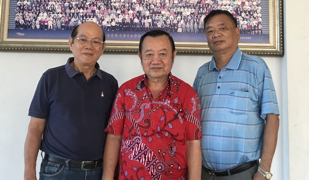 Robin Jonathan (centre) says Japanese imperialists killed his grandfather and uncle. Pictured with him are Nara Indra Halim and Iwan Tirtanata from the Dharma Bhakti Foundation, a Tionghoa organisation, in Samarinda. Photo: Resty Woro Yuniar