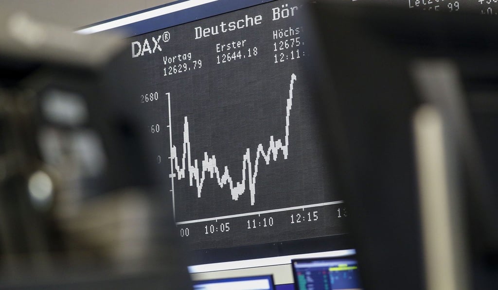 The DAX index curve sits on display beyond trading desks inside the Frankfurt Stock Exchange. Photo: Bloomberg The DAX index curve sits on display beyond trading desks inside the Frankfurt Stock Exchange. Photo: Bloomberg