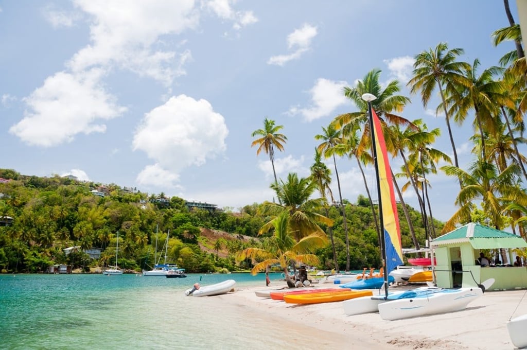 Sailing boats on the shore at Marigot Bay – a popular tourist destination on the island of Saint Lucia. Photo: Shutterstock