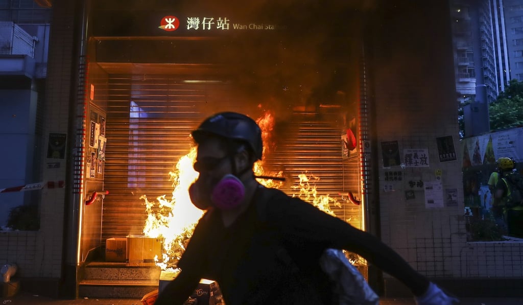 Anti-government protesters start a fire at an entrance of Wan Chai MTR station on September 15. Photo: Sam Tsang