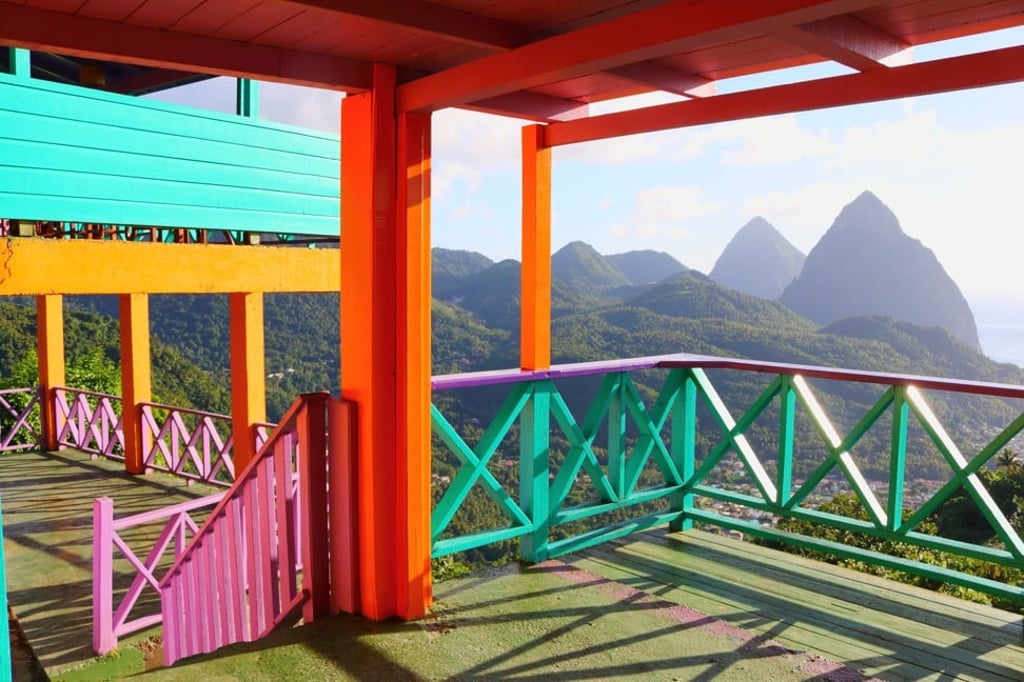 The two mountainous volcanic spires, known as the Pitons, on the coast of Saint Lucia. Photo: Shutterstock