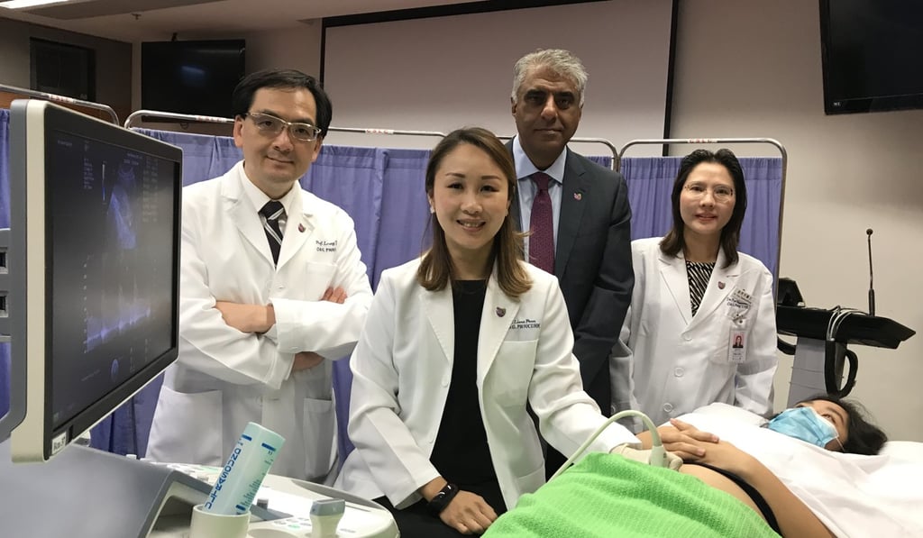 Professor Leung Tak-yeung (left), chairman of Chinese University’s department of obstetrics and gynaecology, and Professor Liona Poon Chiu-yee (centre) are part of the team who have developed an Asian-specific form of the Fetal Medicine Foundation triple test. Photo: Elizabeth Cheung