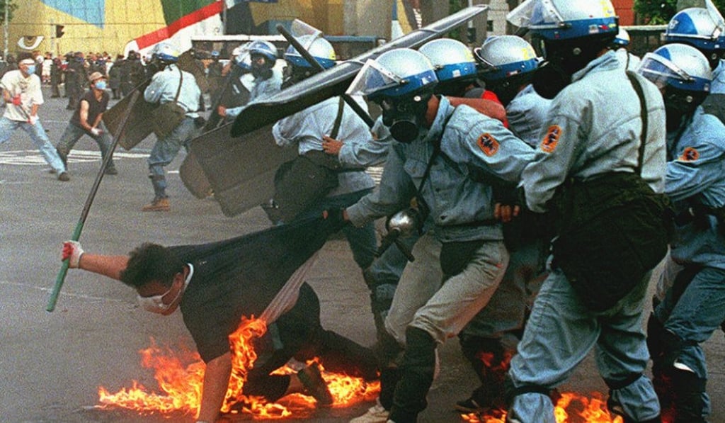 An anti-government student protester falls on his own fire bomb during a battle with riot police in Seoul in this file photo. Photo: AFP