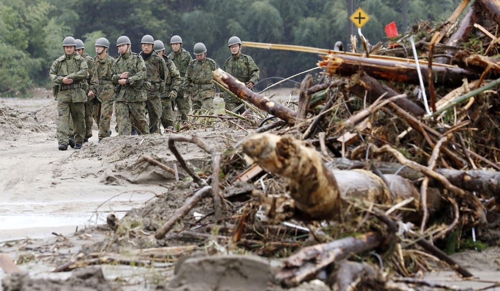 Members of Japan’s Self-Defence Forces inspect the damage in Marumori, northeastern Japan after the area was inundated by Typhoon Hagibis. Photo: Kyodo