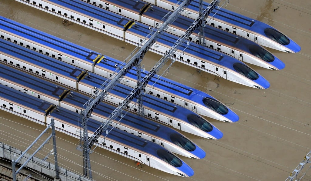 Bullet trains are seen submerged in muddy waters in Nagano, central Japan, after Typhoon Hagibis hit the city. Photo: AP