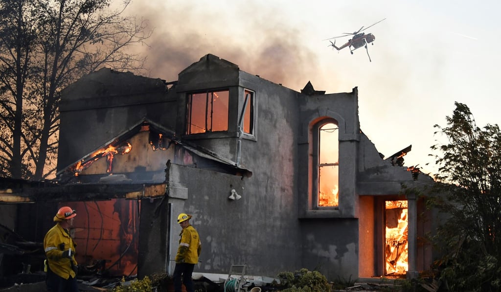 A home destroyed by the fires is seen in the hills of Canyon Country north of Los Angeles. Photo: Reuters A home destroyed by the fires is seen in the hills of Canyon Country north of Los Angeles. Photo: Reuters