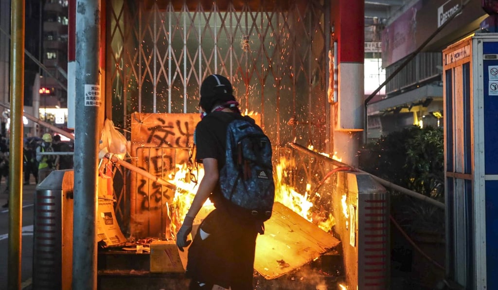 A fire is started at the entrance of Mong Kok MTR station. Photo: Edmond So