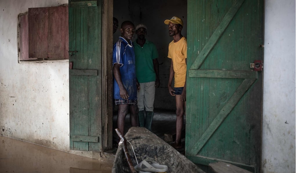 People wait for help in an inundated house in Bangui. Photo: People wait for help in an inundated house in Bangui. Photo: