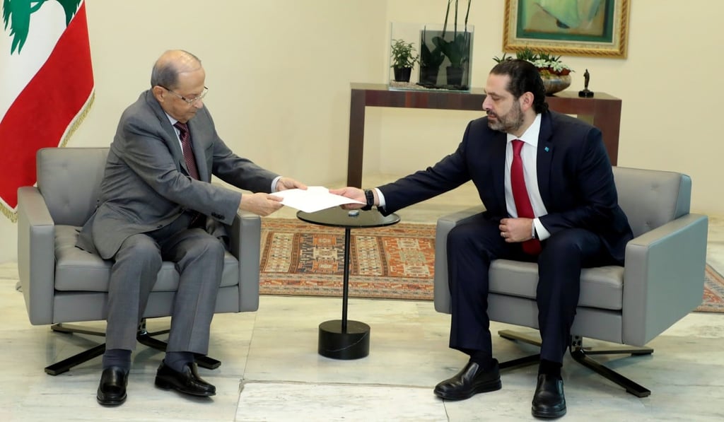 Lebanon's Prime Minister Saad al-Hariri (right) hands over his resignation letter to Lebanon's President Michel Aoun at the Baabda Palace on Tuesday. Photo: Dalati Nohra via Reuters Lebanon's Prime Minister Saad al-Hariri (right) hands over his resignation letter to Lebanon's President Michel Aoun at the Baabda Palace on Tuesday. Photo: Dalati Nohra via Reuters