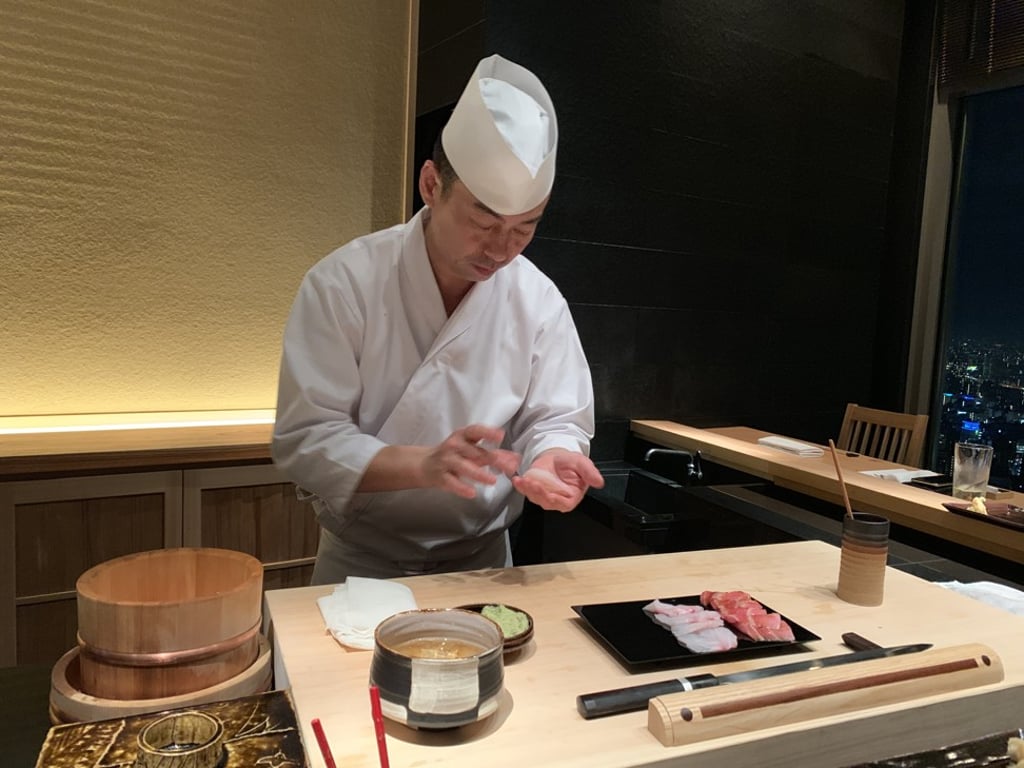 A chef goes to work at Sushi Shin restaurant in Tokyo. Photo: Chris Dwyer