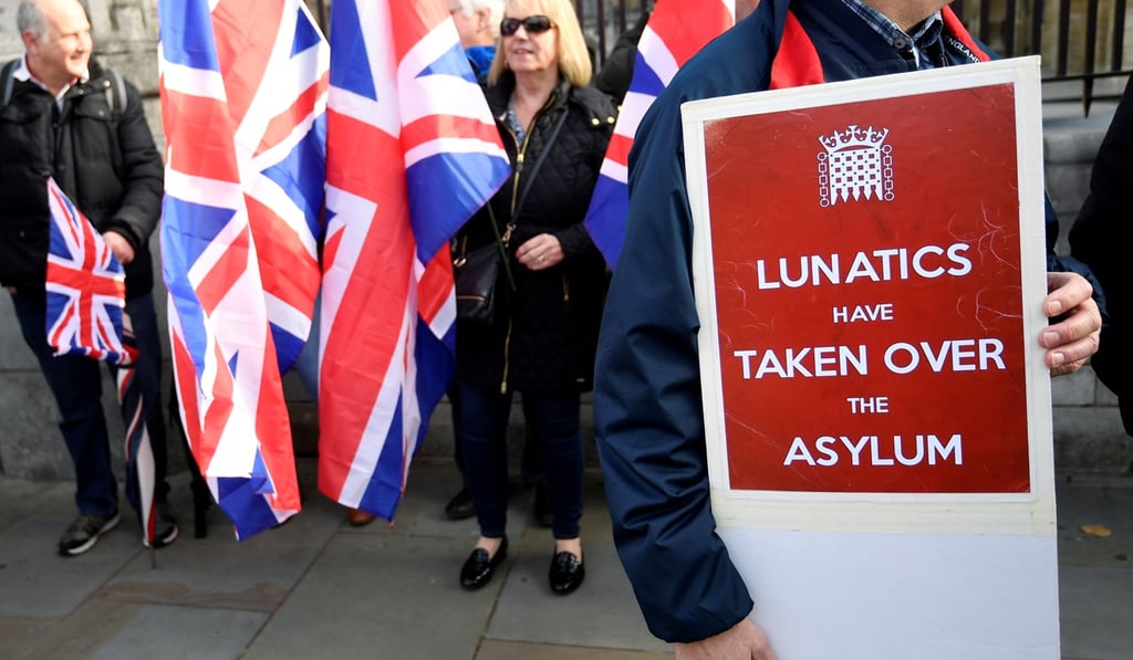 Protesters gather outside the Houses of Parliament in London on Friday. Photo: Reuters