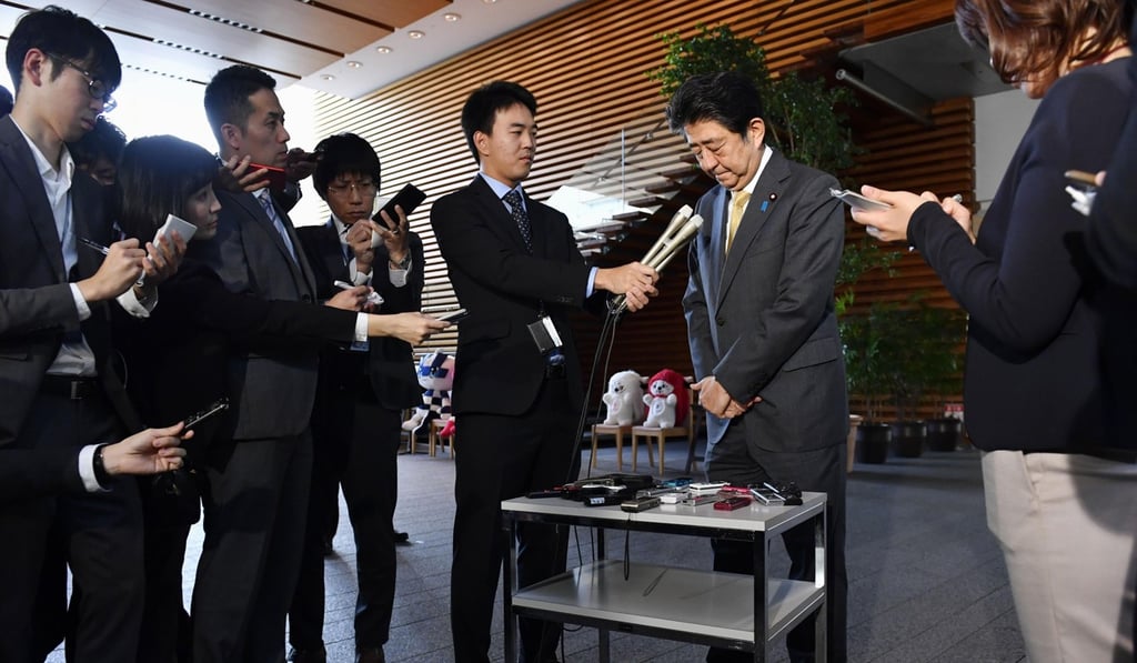 Japanese Prime Minister Shinzo Abe meets the media at his office in Tokyo after receiving a letter of resignation from Justice Minister Katsuyuki Kawai. Photo: Kyodo Japanese Prime Minister Shinzo Abe meets the media at his office in Tokyo after receiving a letter of resignation from Justice Minister Katsuyuki Kawai. Photo: Kyodo