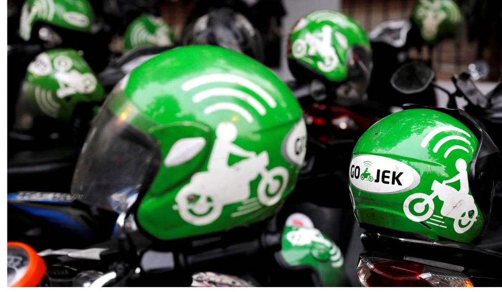 Gojek driver helmets are seen in Jakarta, Indonesia. Photo: Reuters