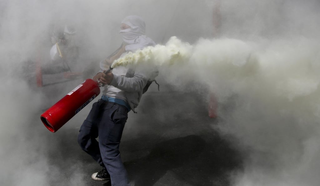 Violent protests in Chile forced the cancellation of the summit. Photo: AP Violent protests in Chile forced the cancellation of the summit. Photo: AP