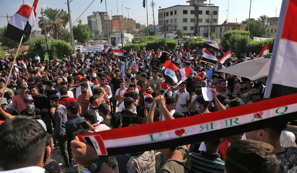 Iraqis take part in ongoing anti-government protests in the central city of Karabala. Photo: AFP