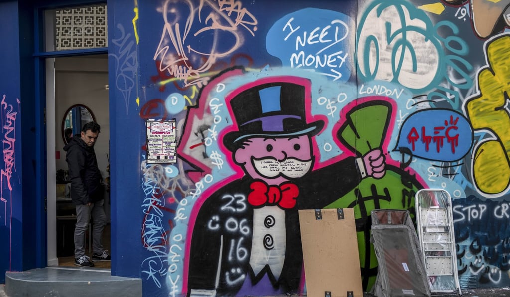 A charity shop covered in a graffiti in the Kensington district of London. Photo: Bloomberg