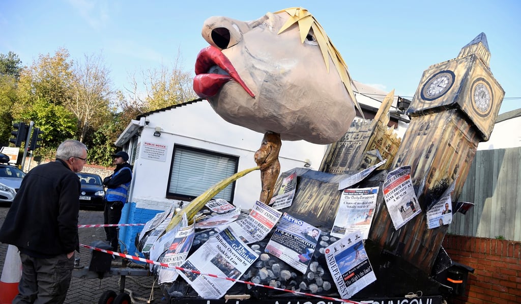 A man looks at an effigy of Britain's Prime Minister Boris Johnson ahead of the annual Bonfire Night festivities in Lewes, Britain, on Tuesday. Photo: Reuters