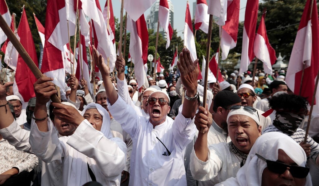 Supporters of Indonesian presidential candidate Prabowo Subianto rally near the Constitutional Court in an effort to challenge the election result that saw him lose to Joko Widodo. Photo: AP