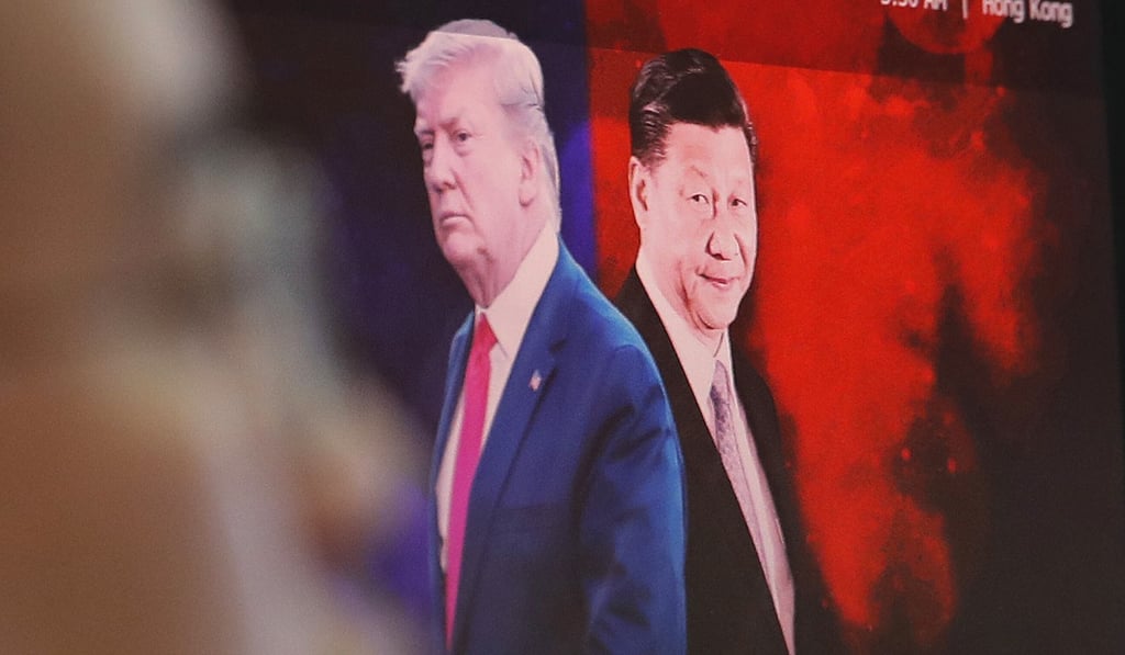 A computer screen shows images of Chinese President Xi Jinping and US President Donald Trump at a bank in Seoul, South Korea. Photo: AP