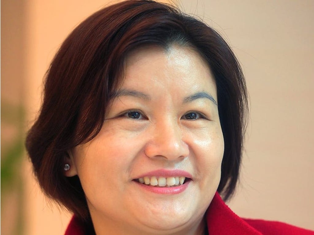 Zhou Qunfei dropped out of high school at 16 to work in a watch lens factory. Photo: AFP