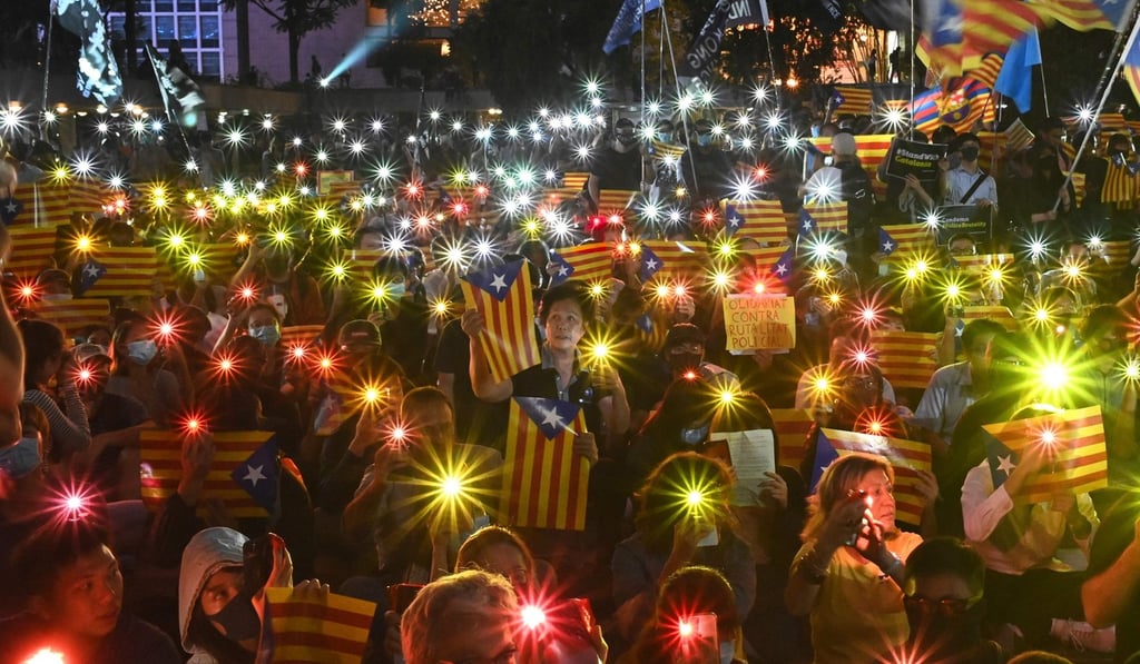 Protesters hold Catalan pro-independence flags at a Hong Kong-Catalonia solidarity assembly in Hong Kong last month. Photo: AFP