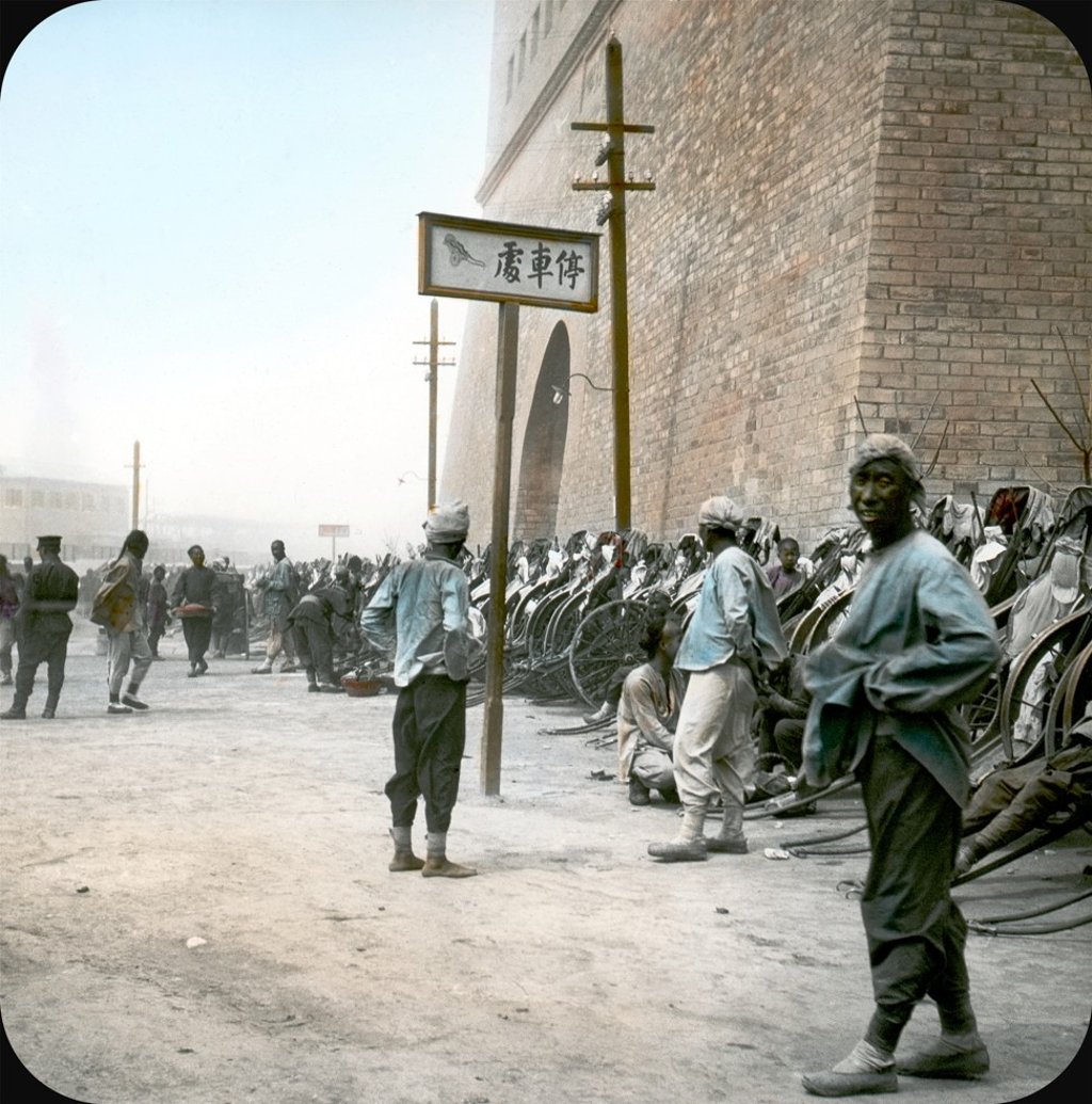 Rickshaw station outside the Qianmen gatehouse, Beijing (1908). Photo: Dezso Bozoky