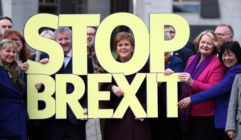 Sturgeon, centre, with other members of the Scottish National Party with a Stop Brexit sign during the party's General Election campaign launch. Photo: DPA