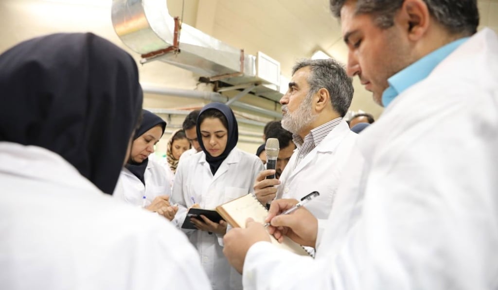 A representative of Iran's Atomic Energy Organisation speaks with local journalists inside of the Fordow nuclear facility in Qom province. Photo: EPA