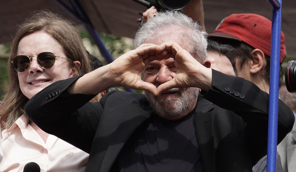 Former Brazilian President Luiz Inacio Lula da Silva flashes a hand heart during a rally at the Metal Workers Union headquarters. Photo: AP Photo