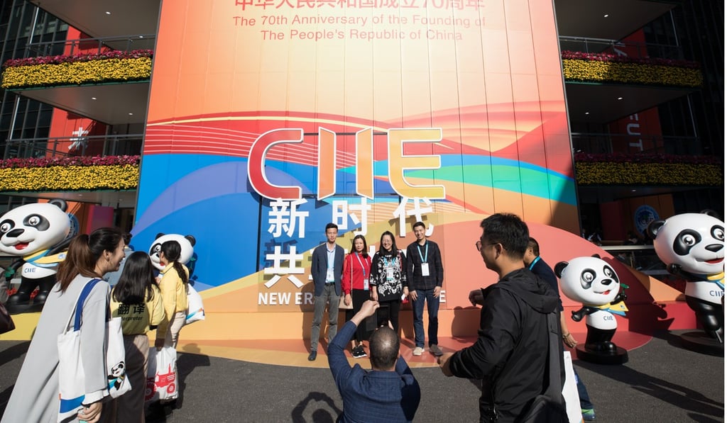 Visitors pose for photos during the second China International Import Expo at the National Exhibition and Convention Centre in Shanghai. Photo: Xinhua