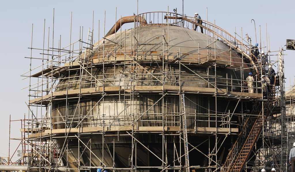 Workers repair Aramco’s processing facility in Abqaiq, near Dammam in Saudi Arabia’s eastern province after the September 14 missile-and-drone attack. Photo: AP Photo