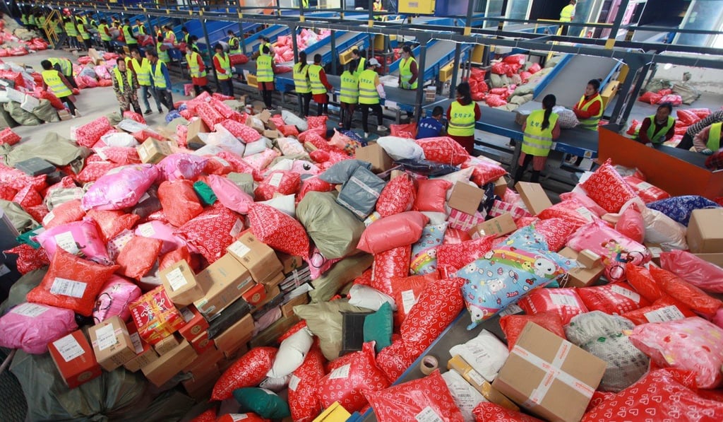 Workers sort packages at the Yuqiao mail processing center on Singles' Day, in Yangzhou City, Jiangsu Province. Photo: EPA