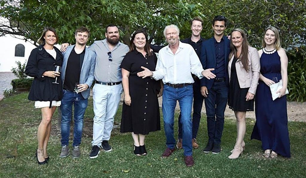 The controversial photo tweeted by Richard Branson (centre) has since been deleted. Photo: Richard Branson via Twitter The controversial photo tweeted by Richard Branson (centre) has since been deleted. Photo: Richard Branson via Twitter