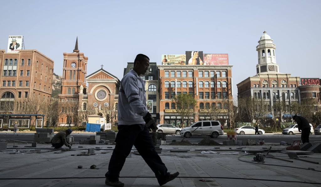A man walks past a Shanghai-mimicking film set at a film set in Qingdao, China, in April 2018. During the late Qing dynasty, Shanghai developed into an important trading port, coming to be known as the “Paris of the East”. Photo: Bloomberg