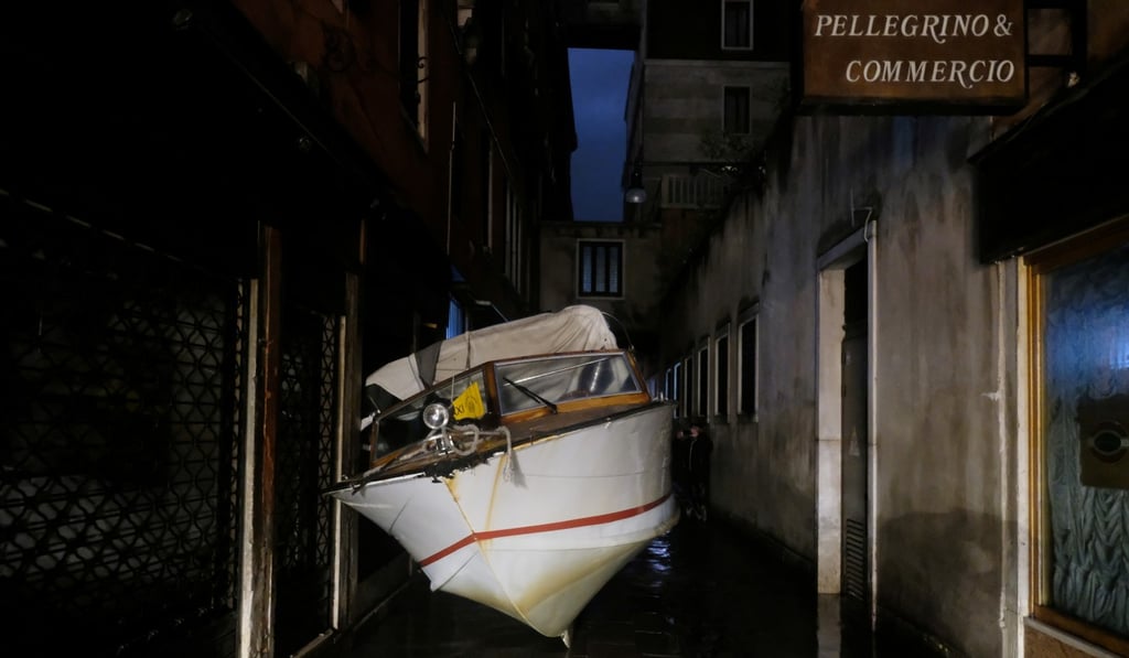 Water taxis were carried by the floodwaters into areas where they’re not usually spotted. Photo: Reuters