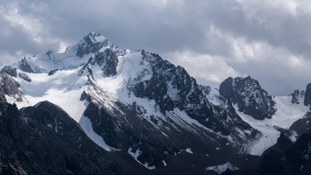 Talgar Peak, 5,000 metres high, towers over Almaty. Buses and trams take residents and visitors more than halfway up its slopes. Photo: Peter Ford
