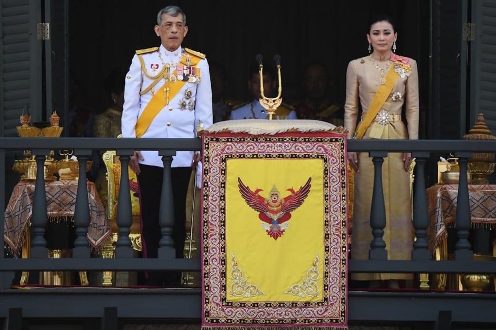 Thailand’s King Maha Vajiralongkorn and Queen Suthida appear on the balcony of Suddhaisavarya Prasad Hall of the Grand Palace in Bangkok. Photo: AFP