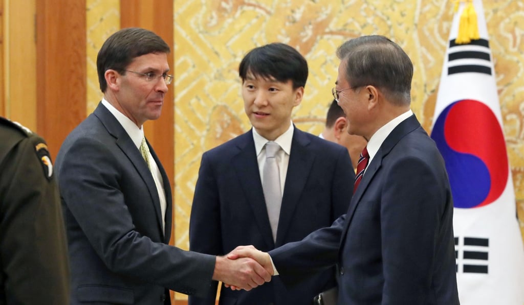 Esper shakes hands with Moon before a meeting at the presidential Blue House in Seoul on Friday. Photo: AP