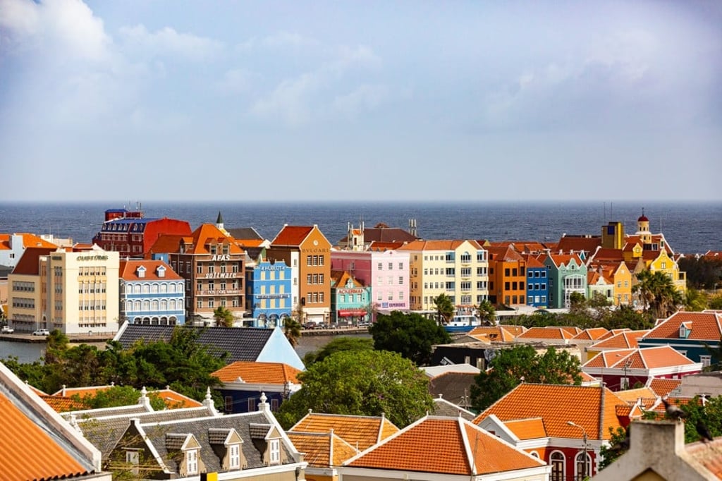 Curacao's capital, Willemstad, is known for its bright-coloured architecture, which embraces styles from the Netherlands and the Spanish and Portuguese colonial towns with which the city engaged in trade.