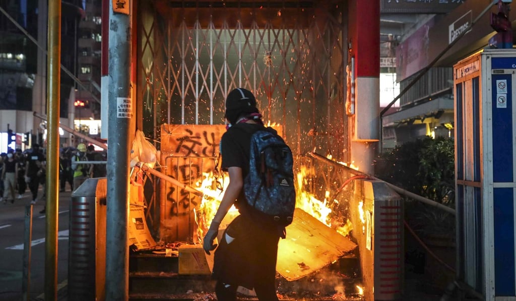 Protesters set fire to the entrance of a Hong Kong metro station. Photo: Edmond So