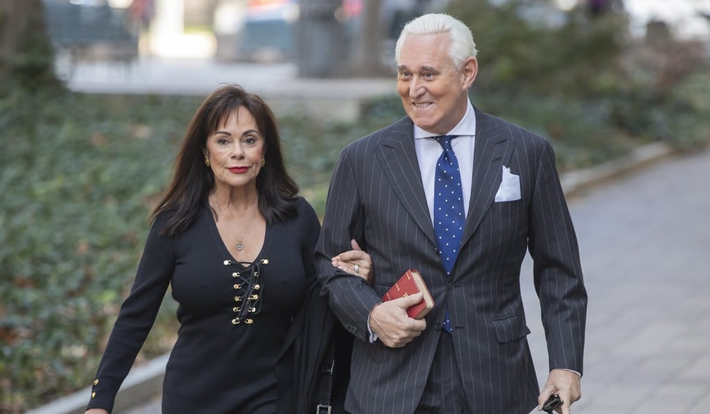 Former Trump adviser Roger Stone holds a Bible as he arrives with his wife, Nydia, for the second day of jury deliberations in his trial in Washington on Friday. Photo: EPA-EFE
