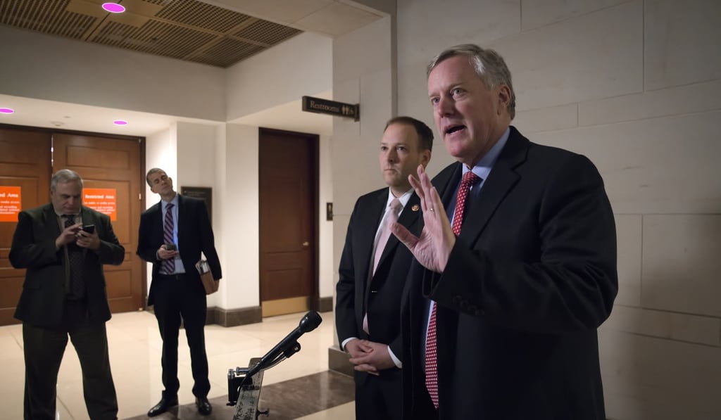 Republican Representative Mark Meadows, joined at left by Democrat Representative Lee Zeldin speaks to reporters as Mark Sandy, a career employee in the White House Office of Management and Budget, is interviewed in a secure room at the Capitol in the House impeachment inquiry. Photo: AP Photo
