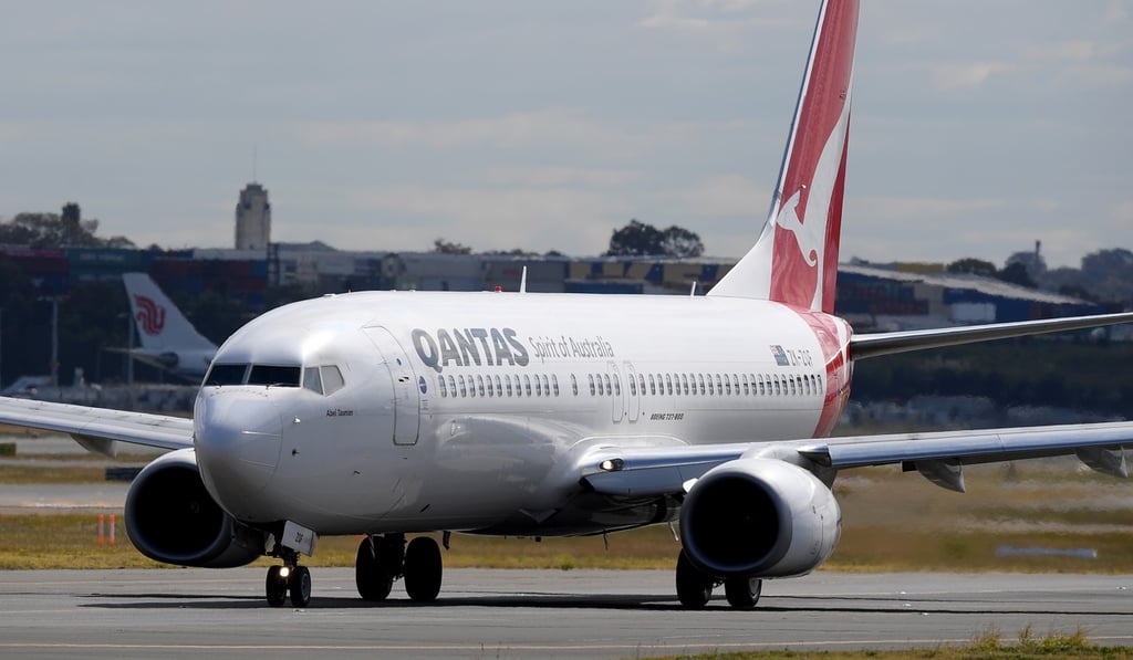 A Qantas Boeing 737-800 aircraft is seen taxiing at Sydney Airport. Photo: EPA A Qantas Boeing 737-800 aircraft is seen taxiing at Sydney Airport. Photo: EPA