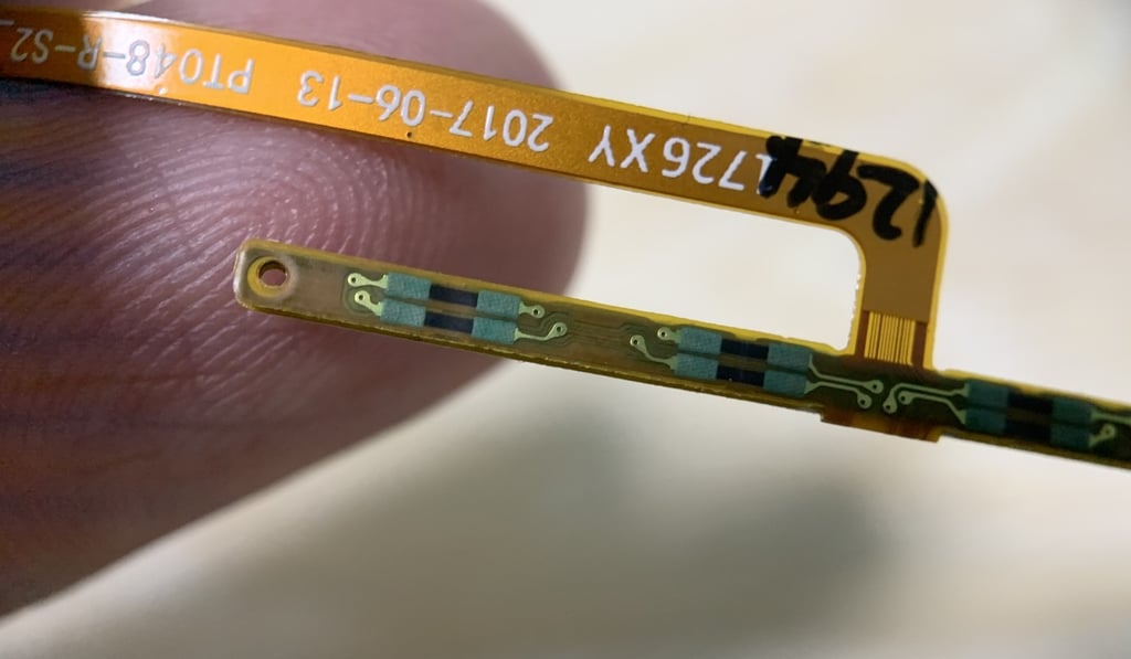The small black rectangles on the chip are the “resistors” that detect “deformations” from the surface they’re attached to. Photo: Ben Sin