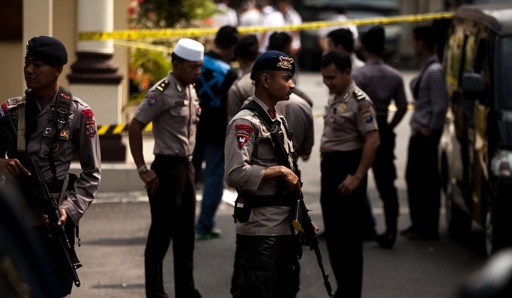 Police officers stand guard at the scene of the Medan bombing. Photo: Xinhua
